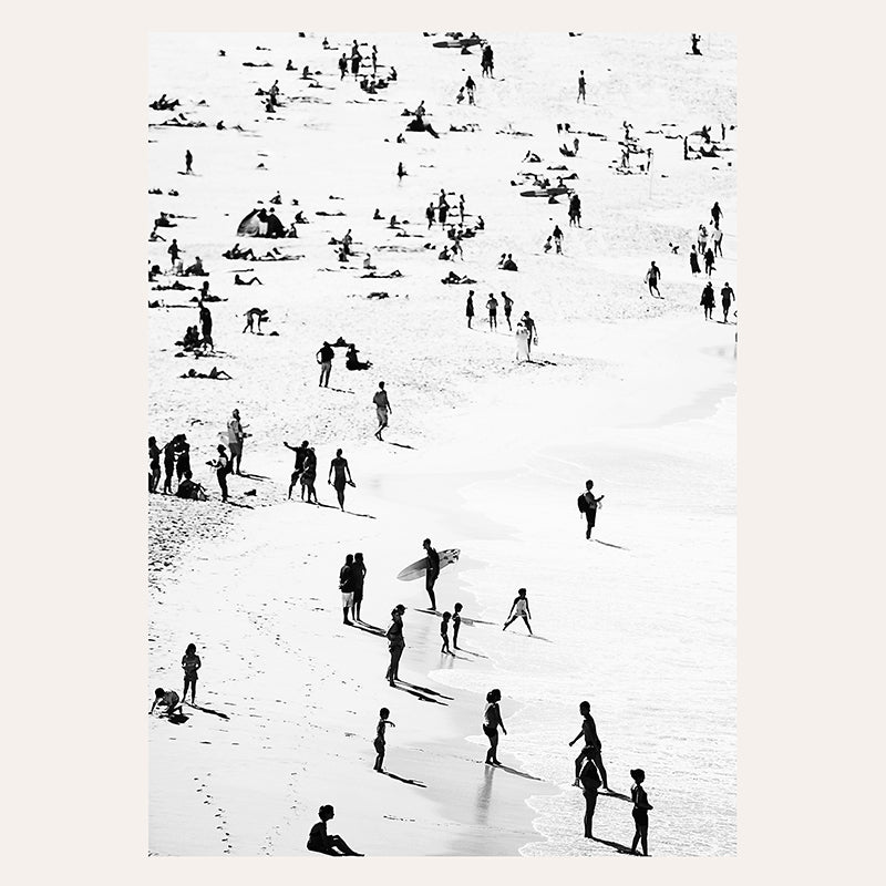 a group of people standing on top of a beach