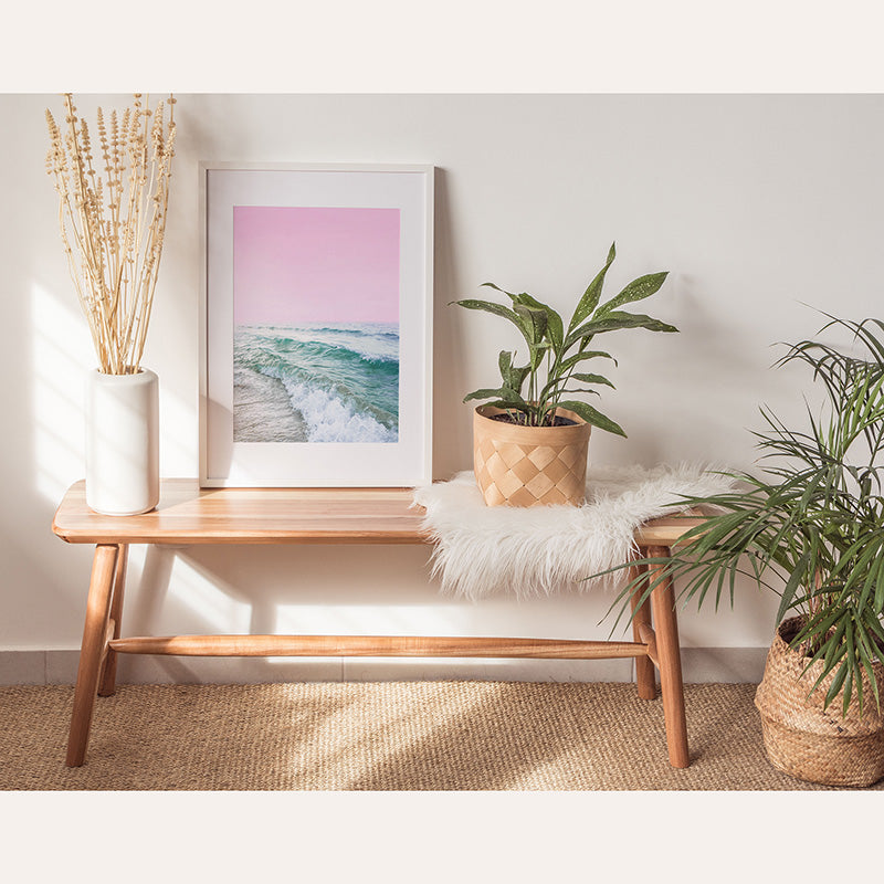 a table with a plant and a picture on it