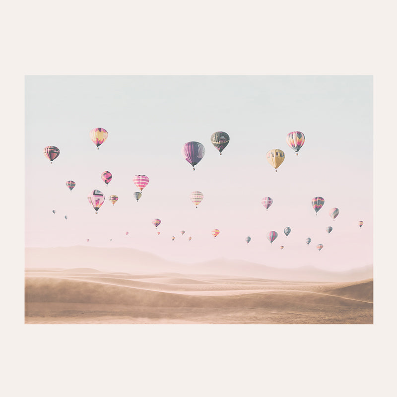 a group of hot air balloons flying in the sky