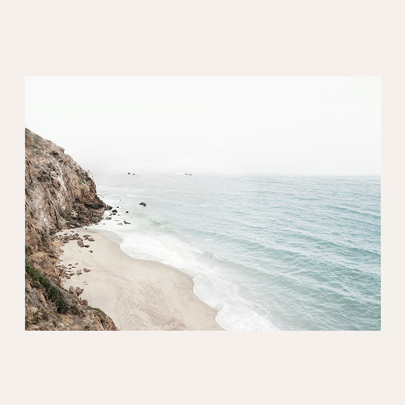 a picture of a beach with waves coming in