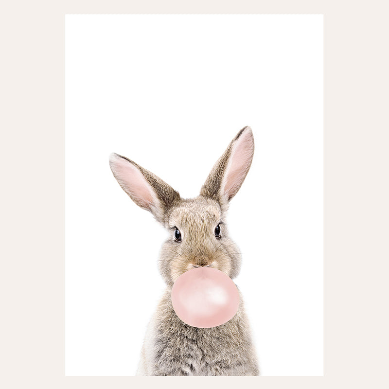 a rabbit with a bubble gum in its mouth