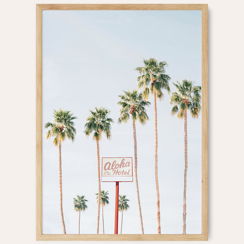 a picture of palm trees and a motel sign