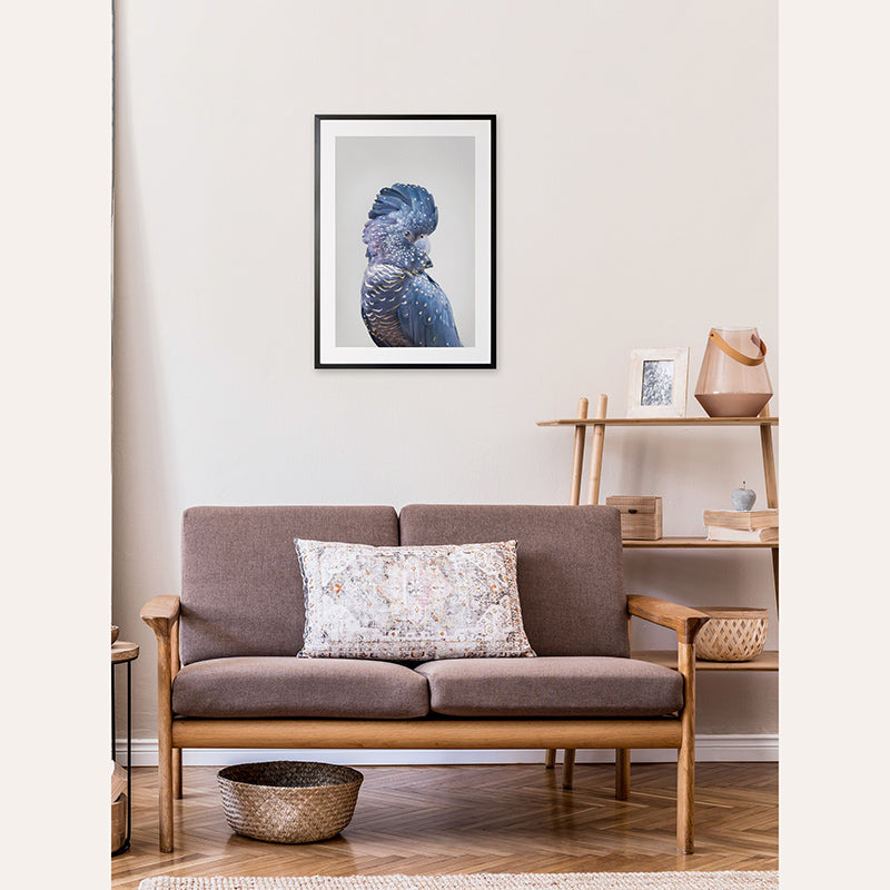 a living room with a couch and a picture on the wall