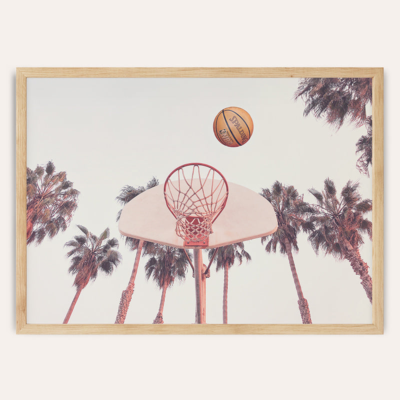 a basketball is in the air above a basketball hoop