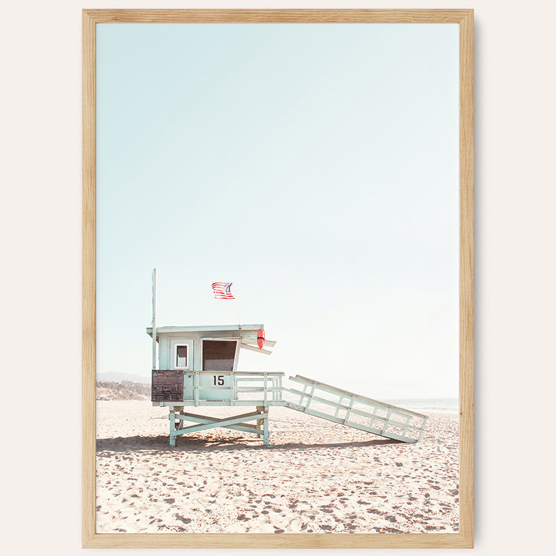 a lifeguard tower on a beach with a life guard ladder