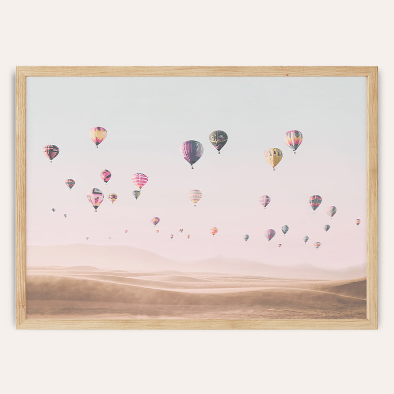 a group of hot air balloons flying in the sky