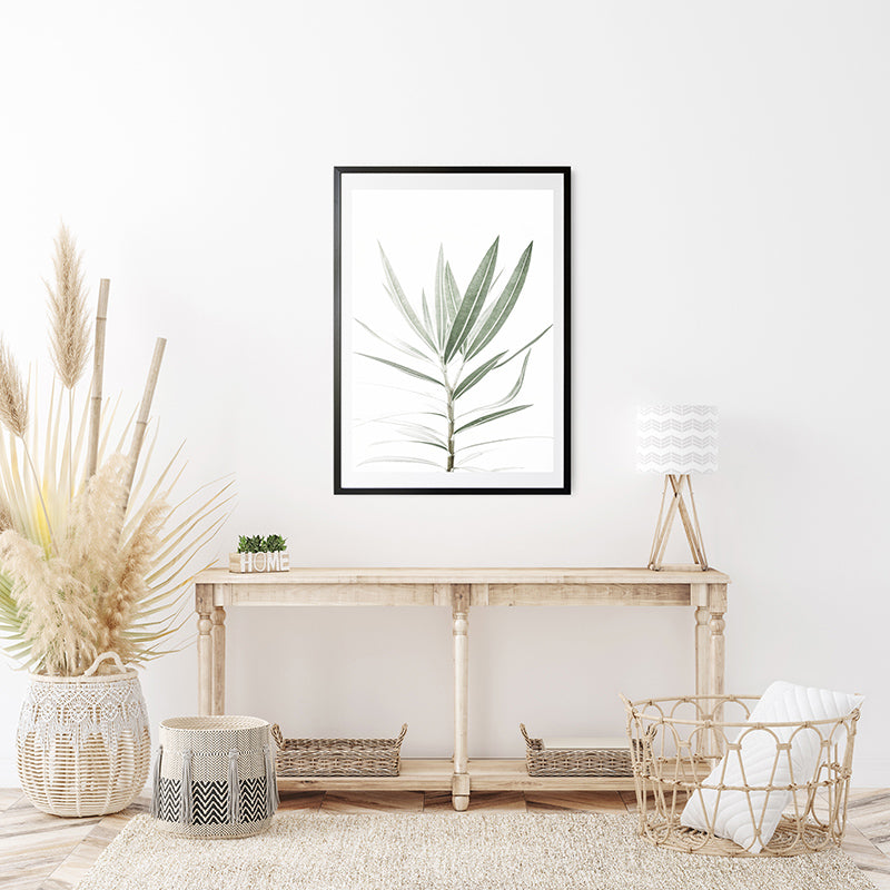 a picture of a plant in a frame on a wall